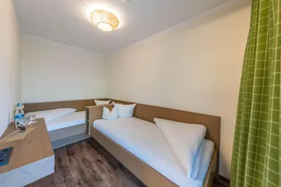 Ein Bett oder Betten in einem Zimmer der Unterkunft Aktivhotel Tuxerhof