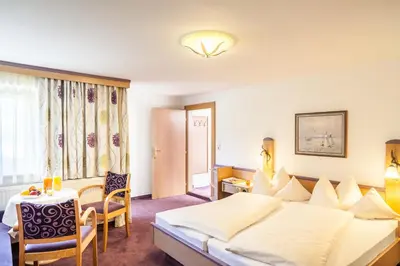 Ein Bett oder Betten in einem Zimmer der Unterkunft Gasthof Ellmauer Hof