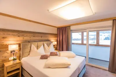 Ein Bett oder Betten in einem Zimmer der Unterkunft Gasthof Ellmauer Hof