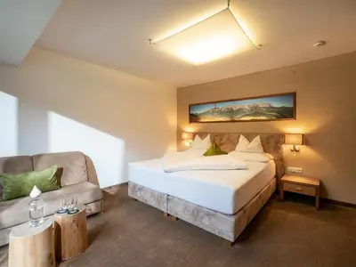 Ein Bett oder Betten in einem Zimmer der Unterkunft Gasthof Ellmauer Hof
