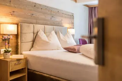 Ein Bett oder Betten in einem Zimmer der Unterkunft Gasthof Ellmauer Hof