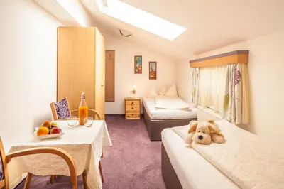Ein Bett oder Betten in einem Zimmer der Unterkunft Gasthof Ellmauer Hof