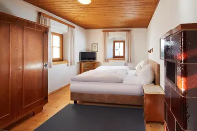 Ein Bett oder Betten in einem Zimmer der Unterkunft Pension Oberbräu