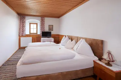 Ein Bett oder Betten in einem Zimmer der Unterkunft Pension Oberbräu