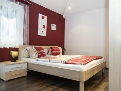 Ein Bett oder Betten in einem Zimmer der Unterkunft Ferienhaus Gartentraum 2