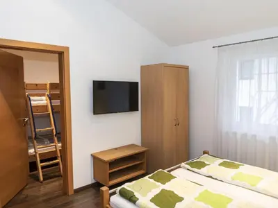 Ein Bett oder Betten in einem Zimmer der Unterkunft Ferienhaus Gartentraum 2