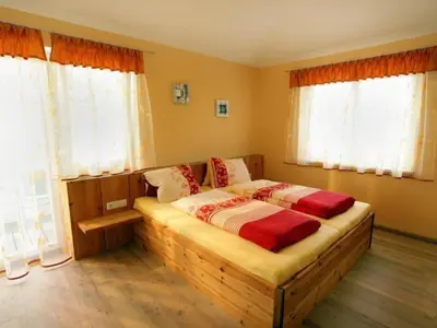 Ein Bett oder Betten in einem Zimmer der Unterkunft Ferienhaus Gartentraum 1