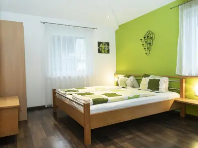 Ein Bett oder Betten in einem Zimmer der Unterkunft Ferienhaus Gartentraum 1
