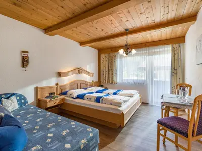 Ein Bett oder Betten in einem Zimmer der Unterkunft Gästehaus Geisler