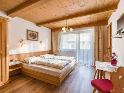 Ein Bett oder Betten in einem Zimmer der Unterkunft Gästehaus Geisler