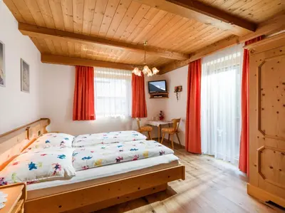 Ein Bett oder Betten in einem Zimmer der Unterkunft Gästehaus Geisler