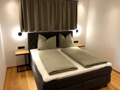 Ein Bett oder Betten in einem Zimmer der Unterkunft BERGGLÜCK
