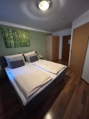 Ein Bett oder Betten in einem Zimmer der Unterkunft Gasthof Wildschönauer Bahnhof