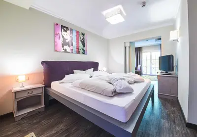 Ein Bett oder Betten in einem Zimmer der Unterkunft THOMSN Central Hotel & Appartements