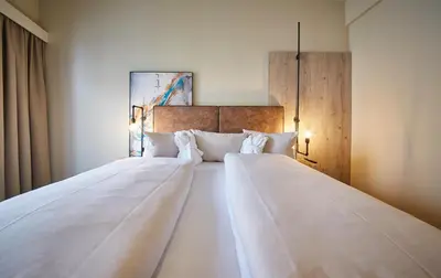 Ein Bett oder Betten in einem Zimmer der Unterkunft THOMSN Central Hotel & Appartements