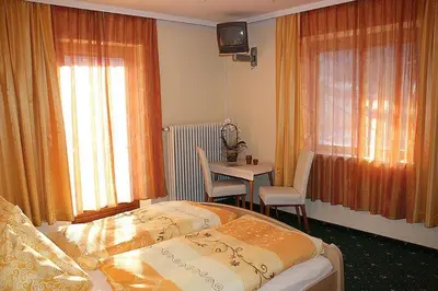 Ein Bett oder Betten in einem Zimmer der Unterkunft Gästehaus Neuhauser