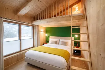 Ein Bett oder Betten in einem Zimmer der Unterkunft SportLodge MOUNTAIN Suite - by AlpenLuxus Collection