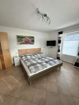 Ein Bett oder Betten in einem Zimmer der Unterkunft Ferienwohnung Astl