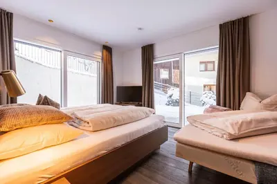 Ein Bett oder Betten in einem Zimmer der Unterkunft Brixental Suites Hopfgarten by ALPS RESORTS