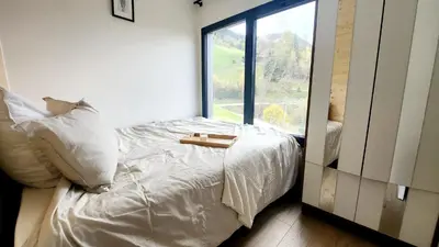 Ein Bett oder Betten in einem Zimmer der Unterkunft Alptime Tiny Lodge
