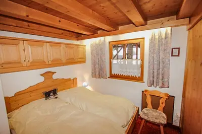 Ein Bett oder Betten in einem Zimmer der Unterkunft Ferienwohnung Königsleiten 251 - Top OG