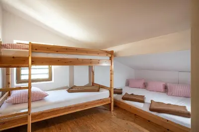 Ein Bett oder Betten in einem Zimmer der Unterkunft Berggasthof Rofan