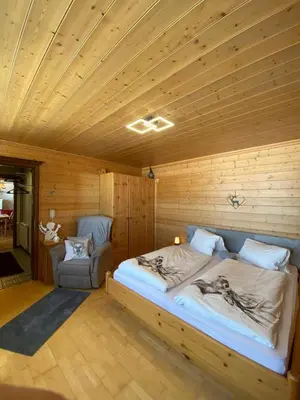 Ein Bett oder Betten in einem Zimmer der Unterkunft Blick Tirol direkt auf der Skipiste