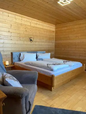 Ein Bett oder Betten in einem Zimmer der Unterkunft Blick Tirol direkt auf der Skipiste