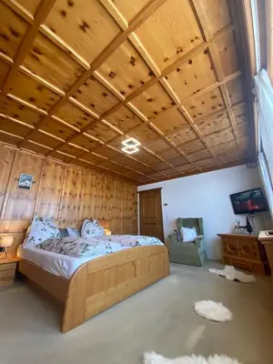 Ein Bett oder Betten in einem Zimmer der Unterkunft Blick Tirol direkt auf der Skipiste