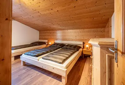 Ein Bett oder Betten in einem Zimmer der Unterkunft Ferienwohnung Zillertal - Schwemberger