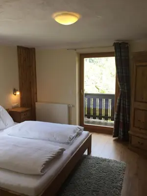 Ein Bett oder Betten in einem Zimmer der Unterkunft Haus Alpenrose