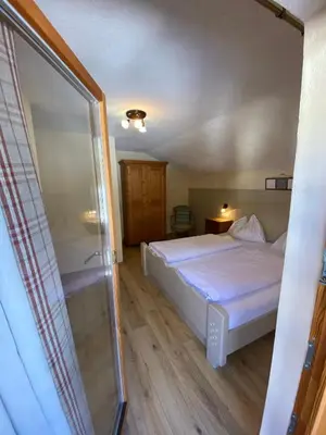 Ein Bett oder Betten in einem Zimmer der Unterkunft Haus Alpenrose