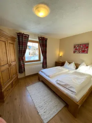 Ein Bett oder Betten in einem Zimmer der Unterkunft Haus Alpenrose