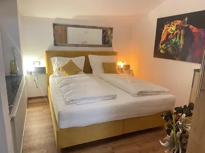 Ein Bett oder Betten in einem Zimmer der Unterkunft Komfort-Apartments Waidring