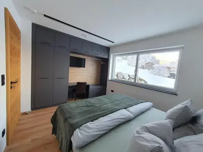 Ein Bett oder Betten in einem Zimmer der Unterkunft Zillernest Apartment
