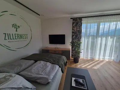 Ein Bett oder Betten in einem Zimmer der Unterkunft Zillernest Apartment
