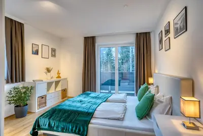 Ein Bett oder Betten in einem Zimmer der Unterkunft NA-Home Kitzbühel
