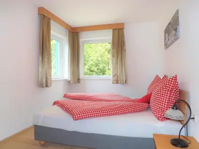 Ein Bett oder Betten in einem Zimmer der Unterkunft Apartments Scheffau