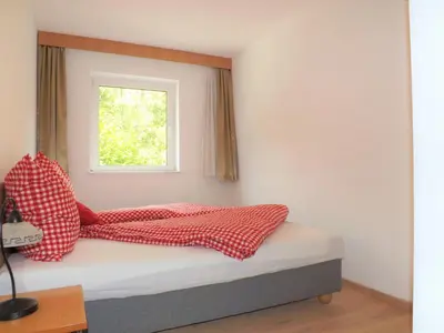 Ein Bett oder Betten in einem Zimmer der Unterkunft Apartments Scheffau