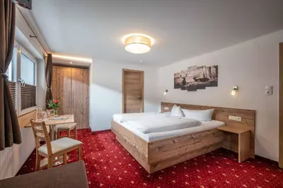 Ein Bett oder Betten in einem Zimmer der Unterkunft Garni Nill