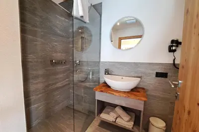 Ein Badezimmer in der Unterkunft Chalet - Das Schrofen