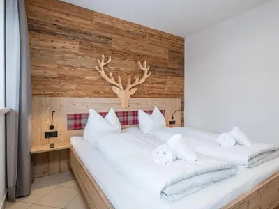 Ein Bett oder Betten in einem Zimmer der Unterkunft Arianne Ski in - Ski out