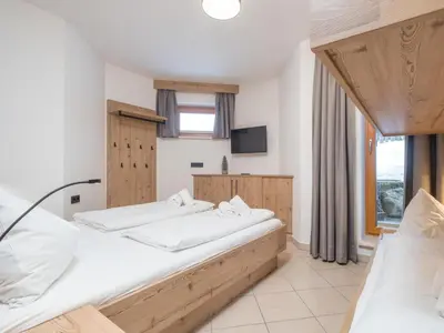 Ein Bett oder Betten in einem Zimmer der Unterkunft Arianne Ski in - Ski out