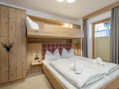 Ein Bett oder Betten in einem Zimmer der Unterkunft Arianne Ski in - Ski out