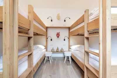 Ein Bett oder Betten in einem Zimmer der Unterkunft Wasserfall Lodge Krimml