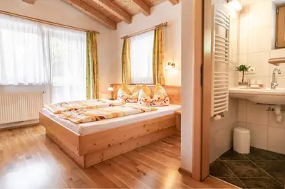 Ein Bett oder Betten in einem Zimmer der Unterkunft Landhaus Sonnblick