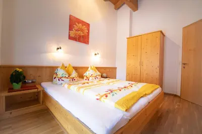 Ein Bett oder Betten in einem Zimmer der Unterkunft Landhaus Sonnblick
