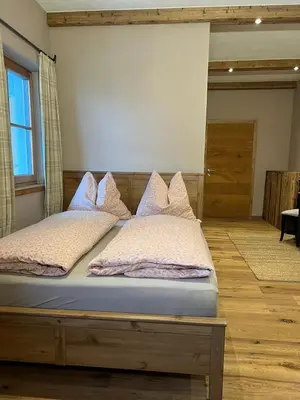 Ein Bett oder Betten in einem Zimmer der Unterkunft Zimmer in Kirchberg in Tirol