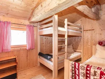 Ein Bett oder Betten in einem Zimmer der Unterkunft Almhütte Bairau Kaser