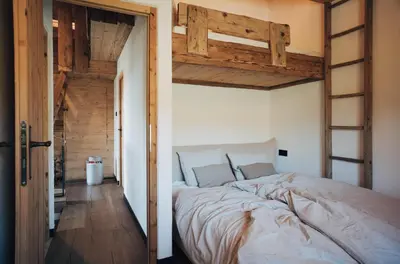 Ein Bett oder Betten in einem Zimmer der Unterkunft L.A. MOUNTAIN LODGE